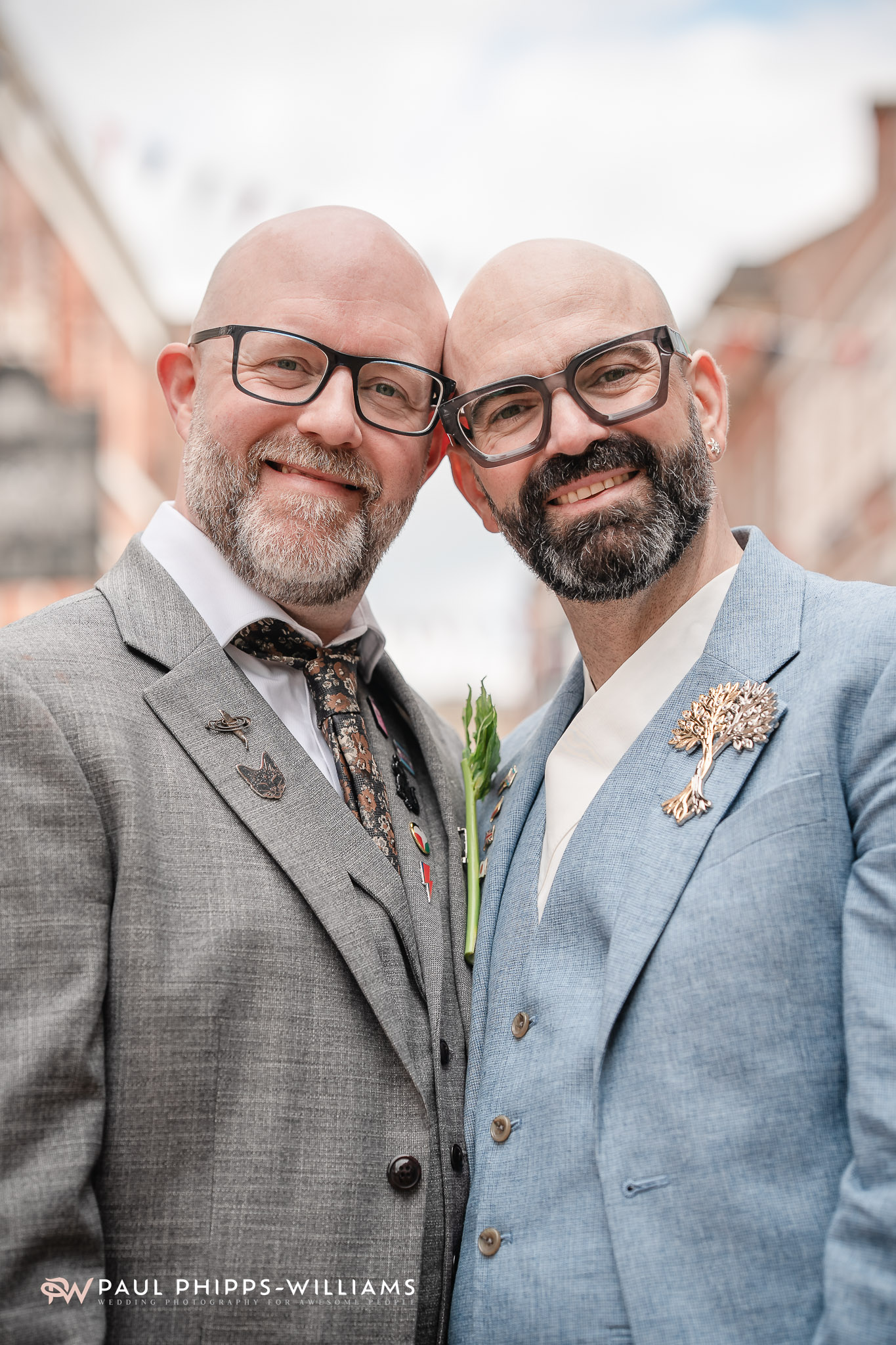 Two grooms look at the camera in Derby Town Centre