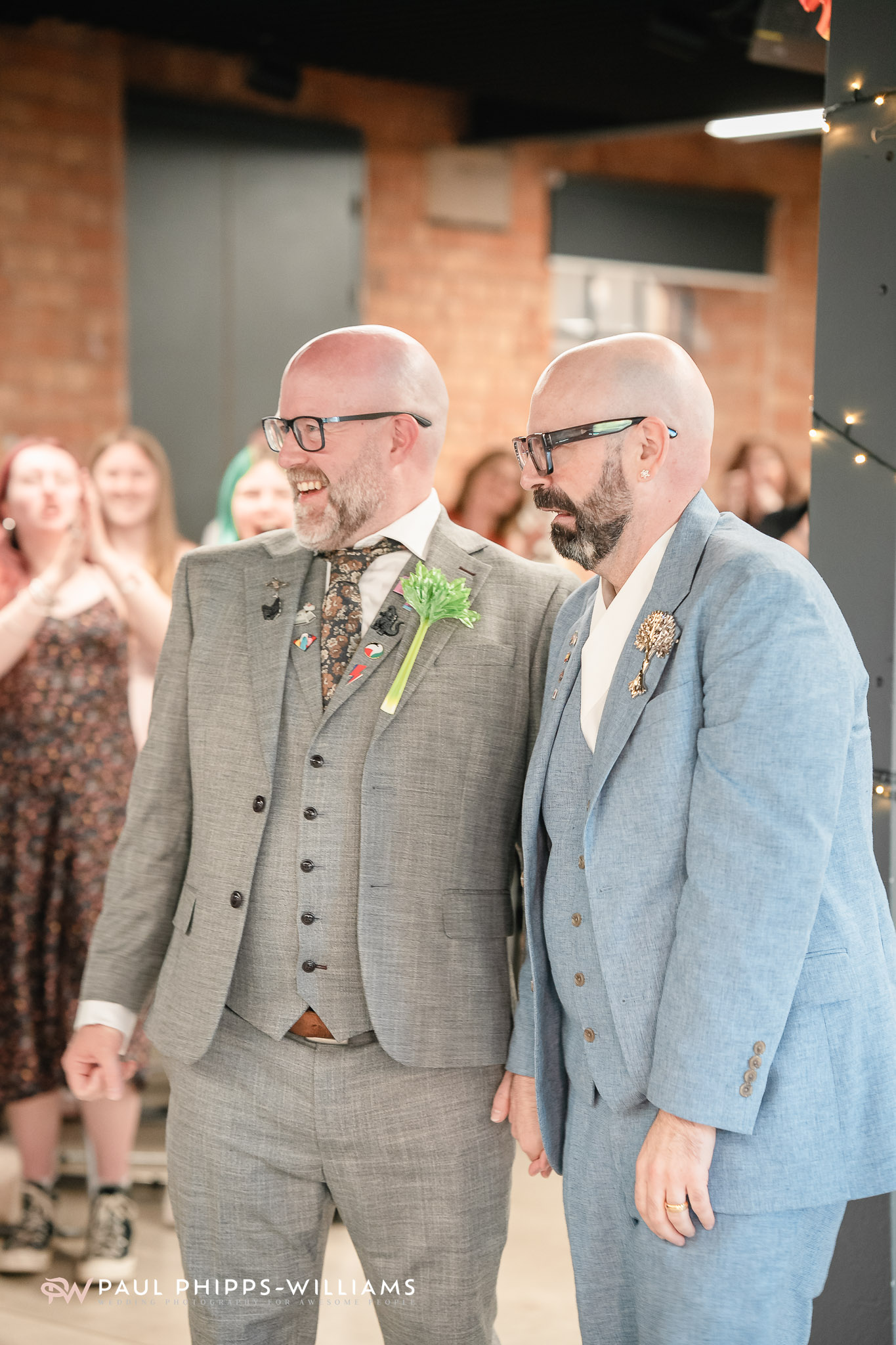 Same-sex couple at their wedding reception at the Museum of Making