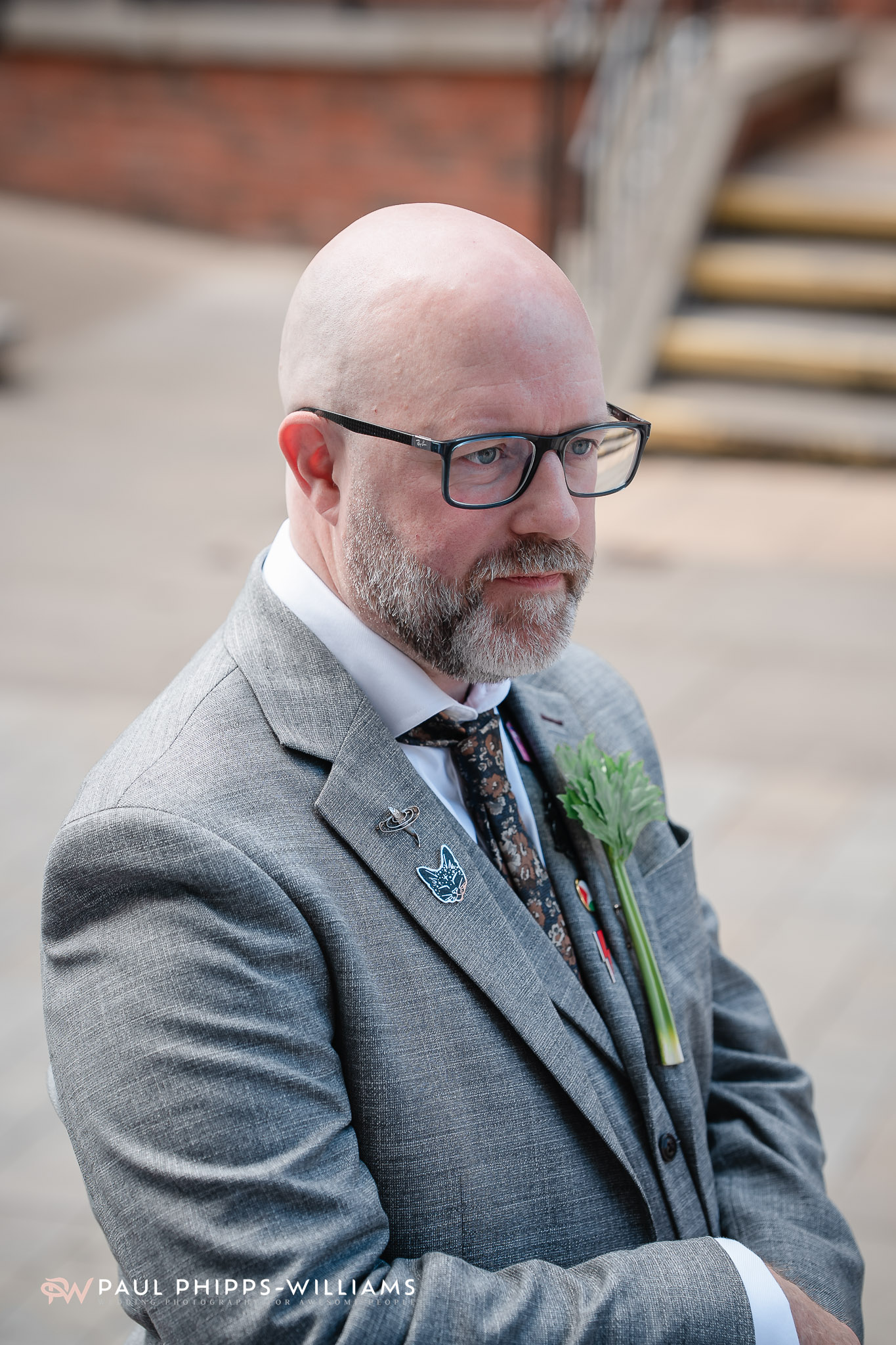 A groom waits outside Derby Registry Office