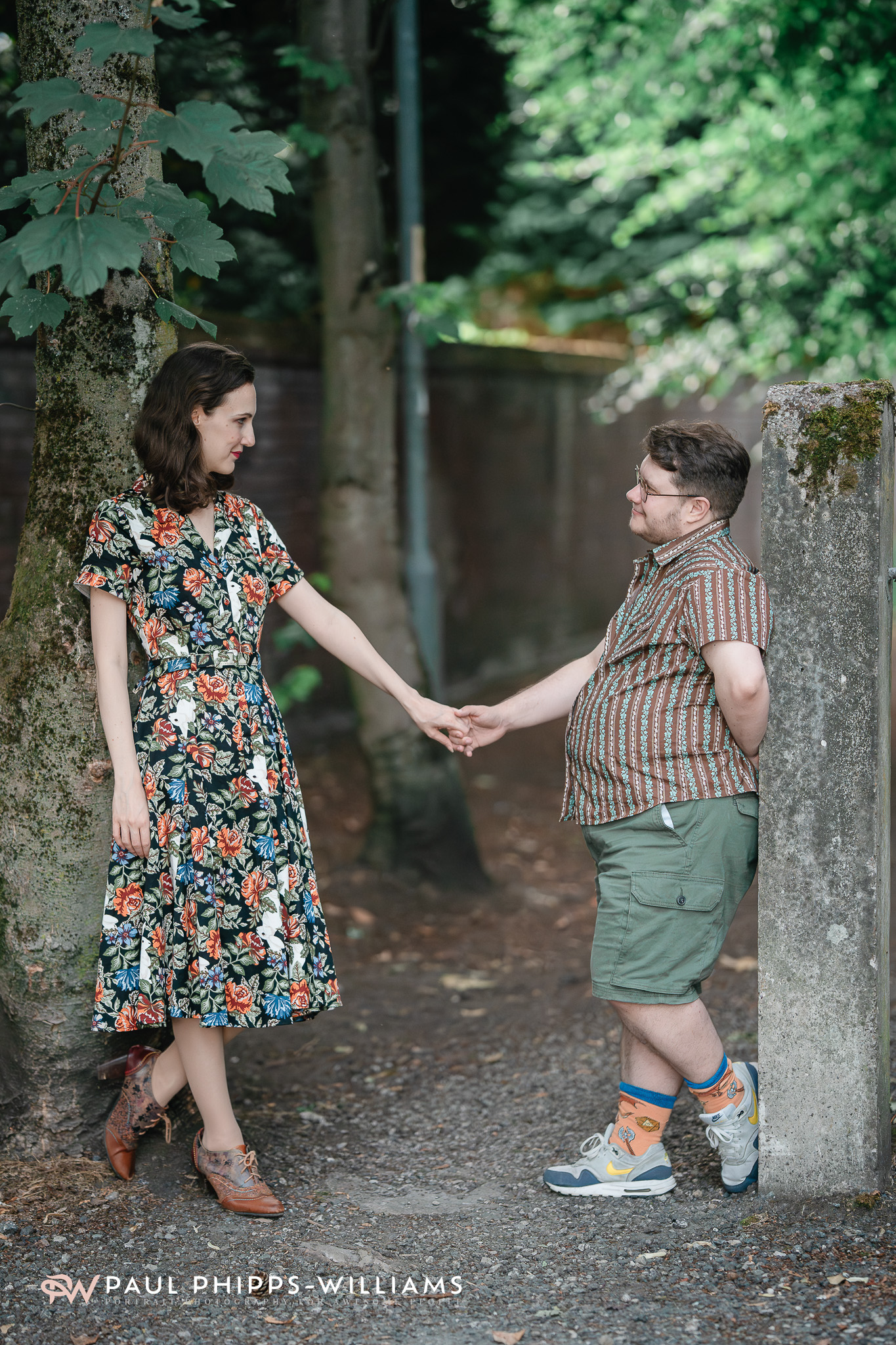 Fio and Georgia hold hands in a Manchester park