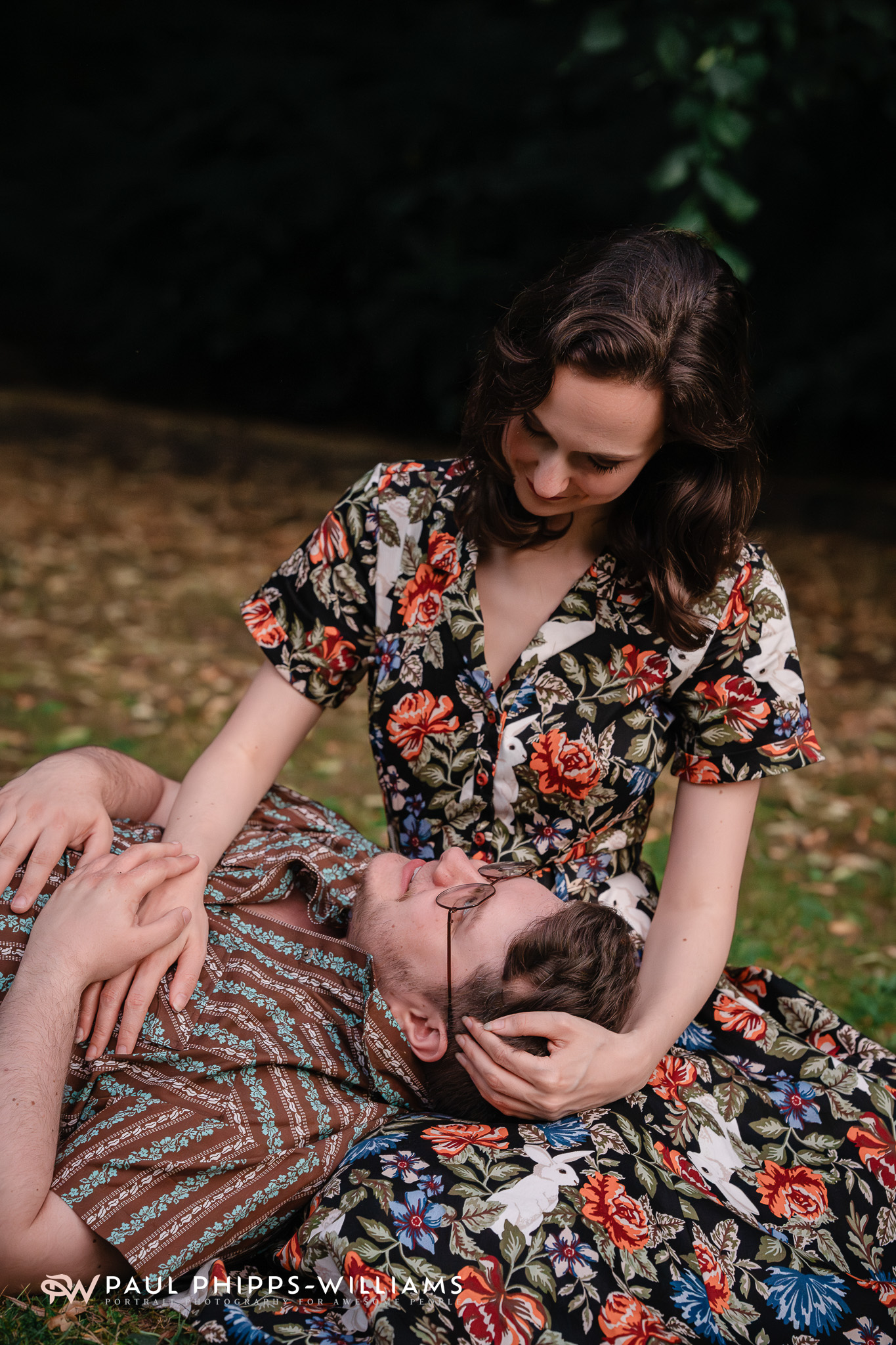 Fio puts his head in Georgia's lap at golden hour in Manchester