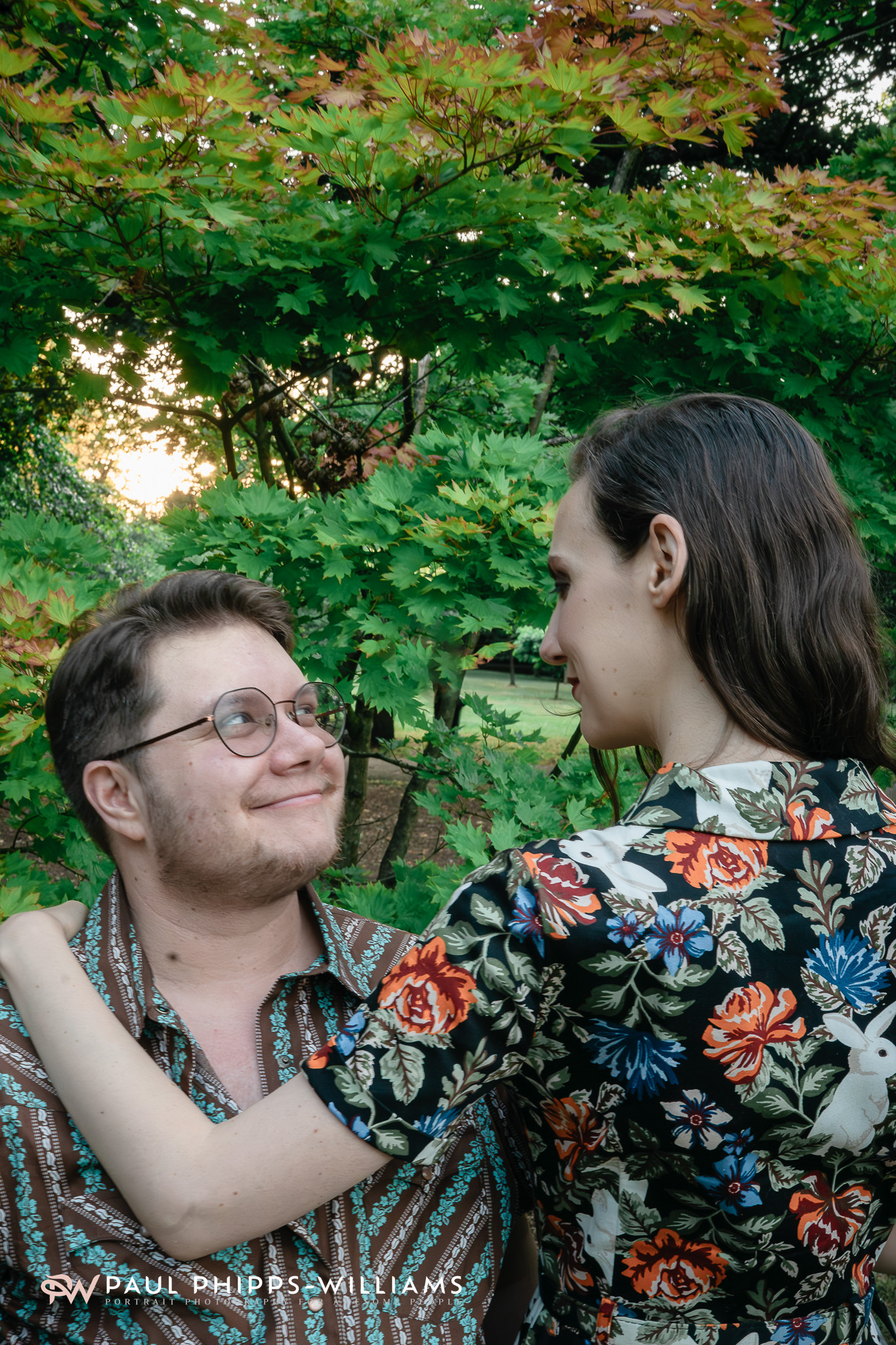 Fio, a trans man from Manchester, looks lovingly at Georgia.