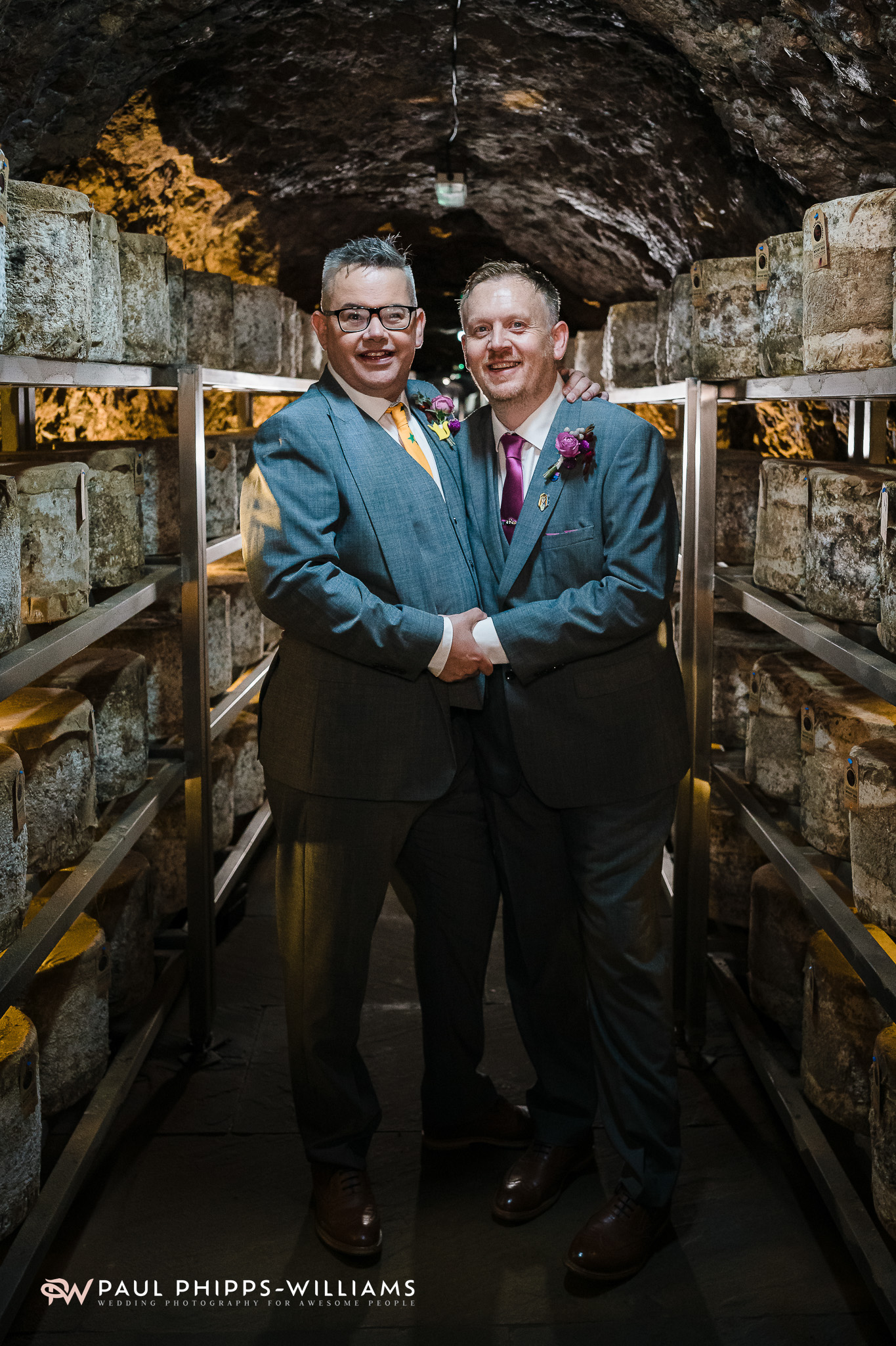 Inside the cheese store during Andy and Dan's Wookey Hole wedding