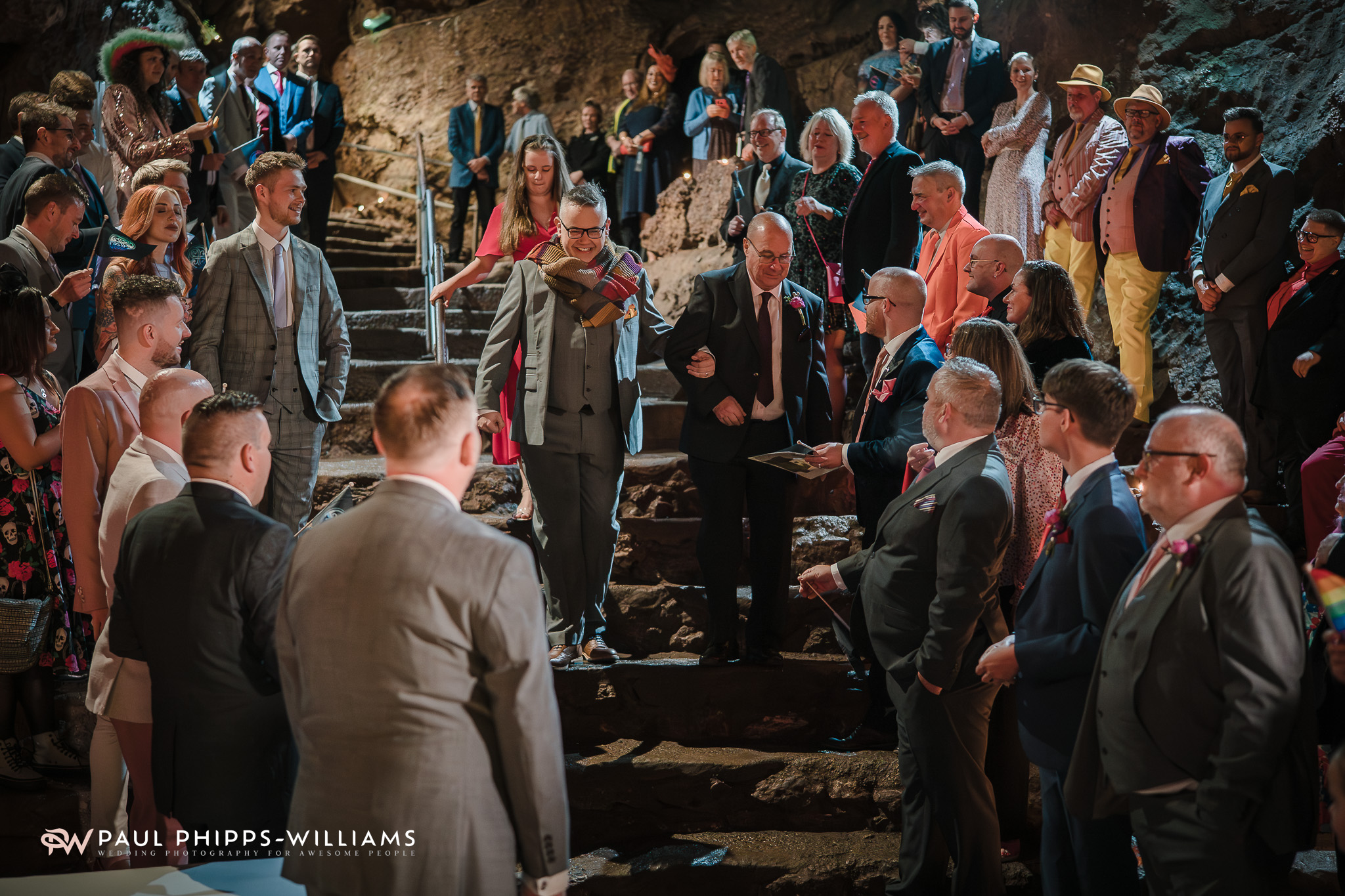 Andy walks down the steps in the Witch's Kitchen during his Wookey Hole Wedding