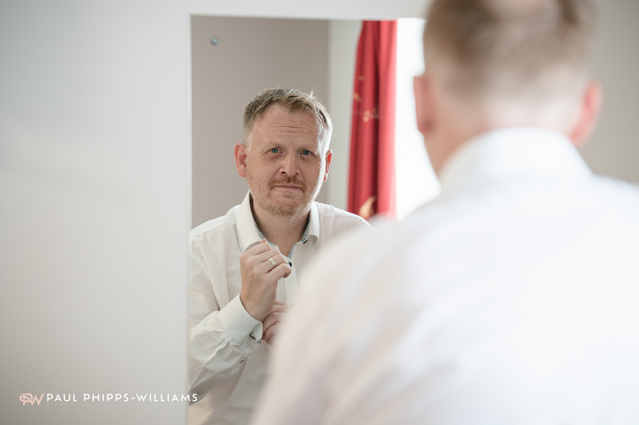 A groom prepares for his wedding in the accommodation at Wookey hole Caves