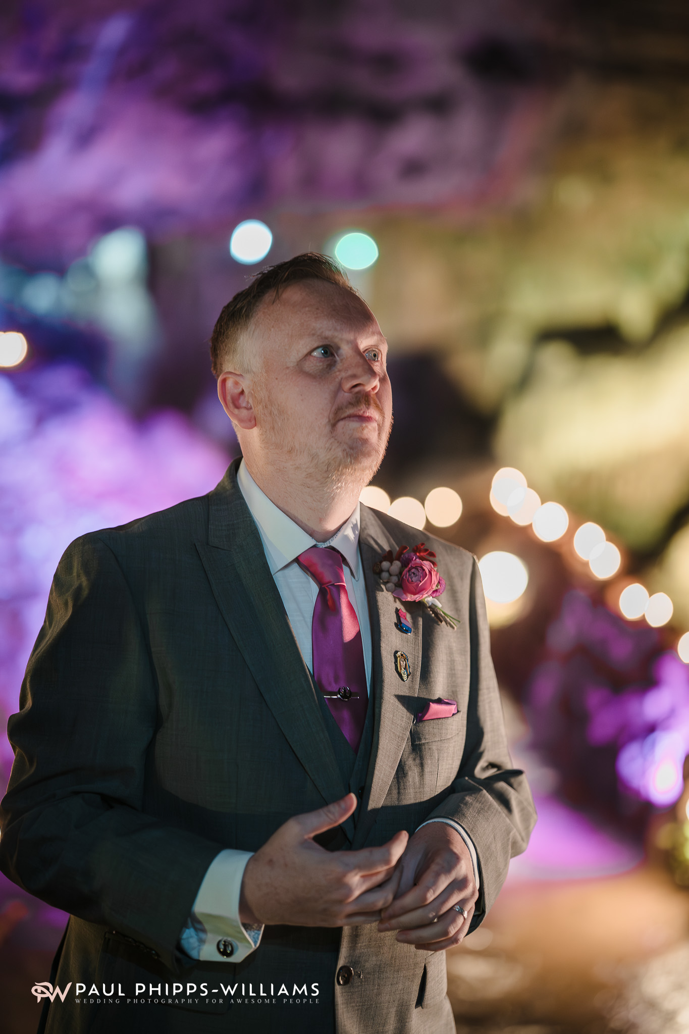 A groom waits for his husband to be at Wookey Hole caves