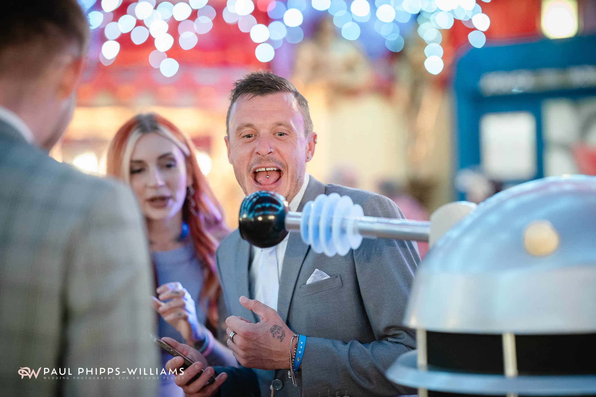 Wedding guests laugh as a Dalek approaches at Wookey Hole