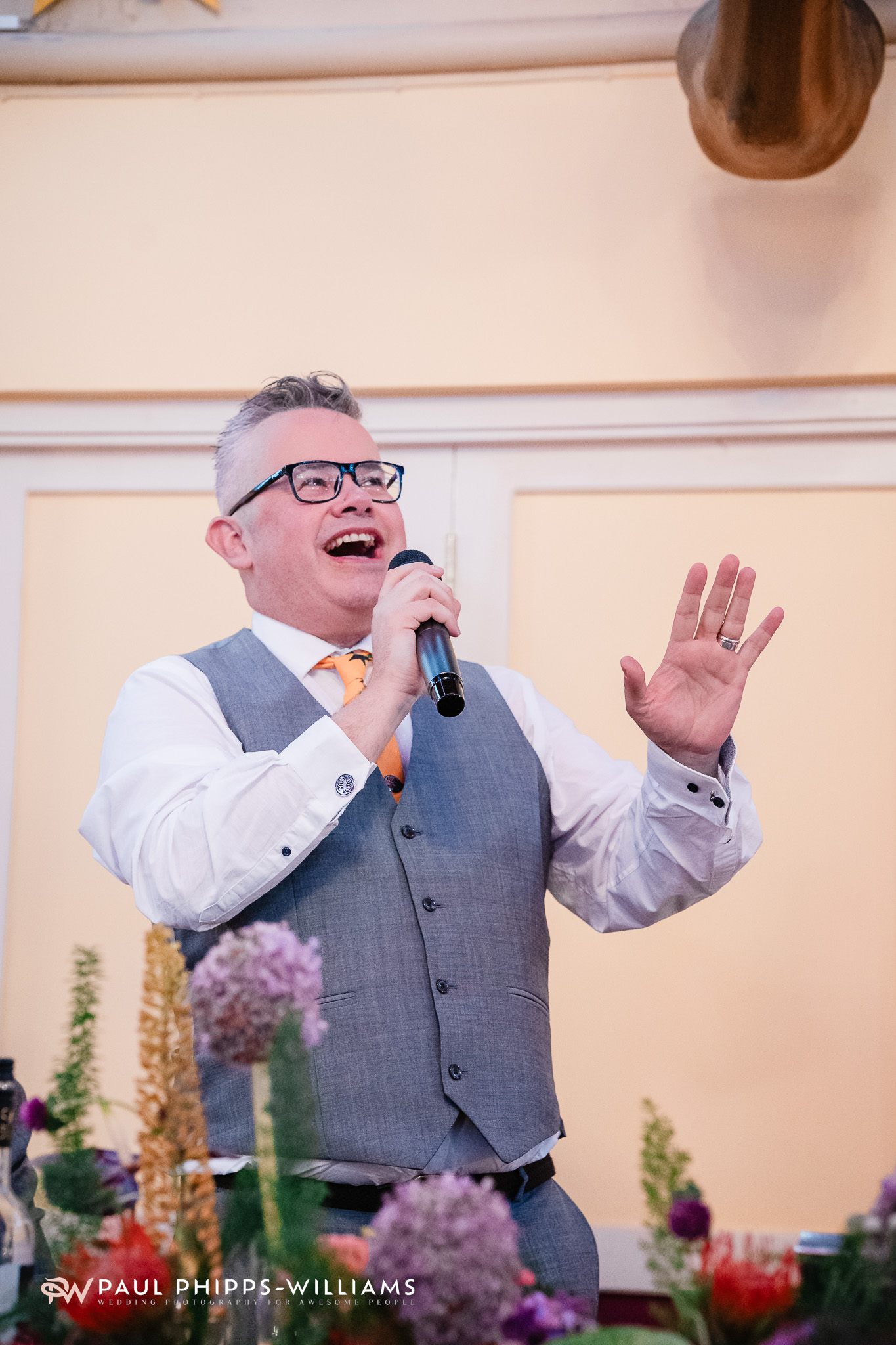 Andy stands and gives his speech at Wookey Hole