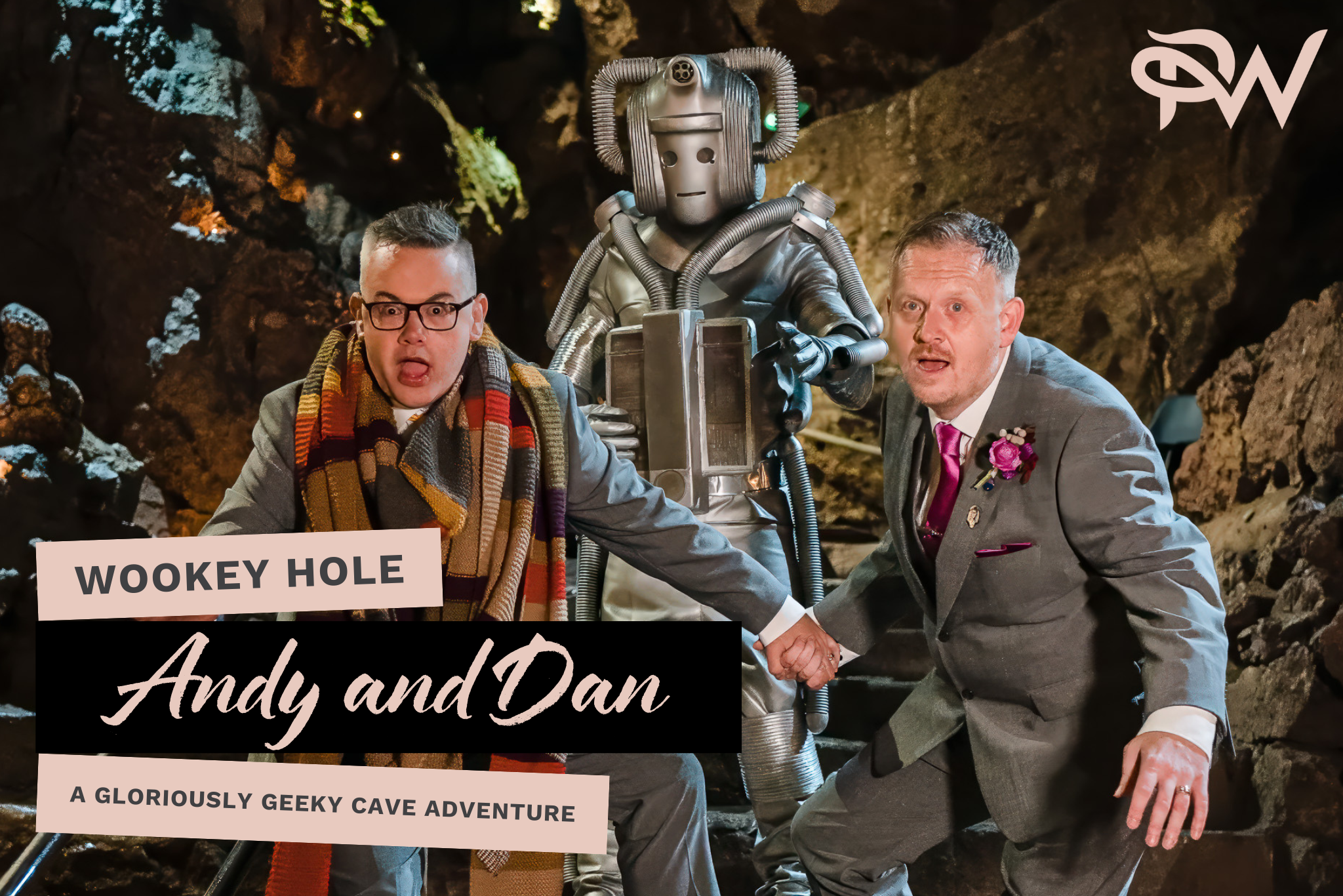 Cover for Andy and Dan's Wookey Hole Wedding - Andy and Dan on the steps of the With's Kitchen with a Cyberman behind them