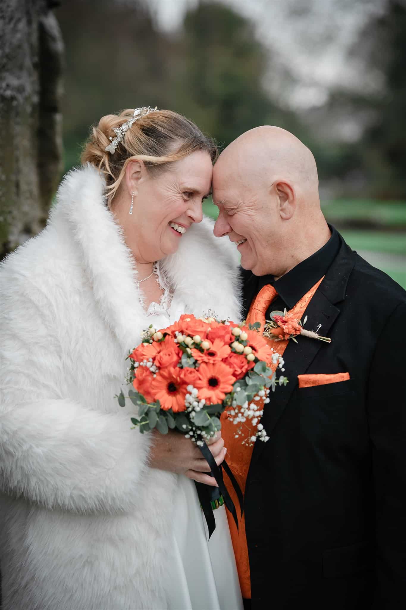 A bride and groom after their wedding in the ruins at priory park dudley