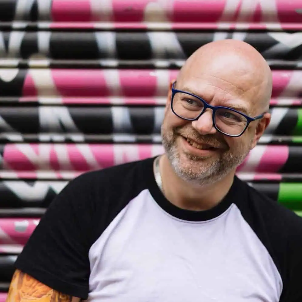 Paul Phipps-WIlliams by a graffiti wall