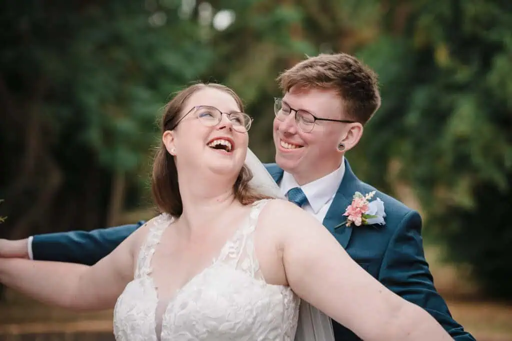 a couple on their wedding day in priory park, dudley