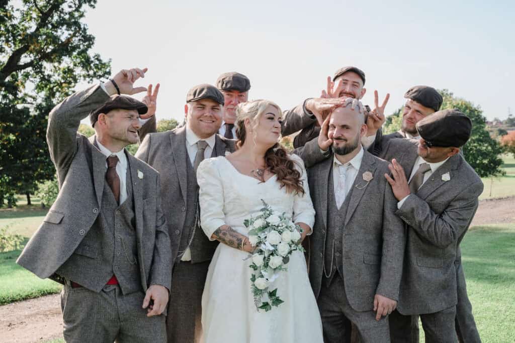 a bride surrounded by groomsmen at Windmill Village Coventry